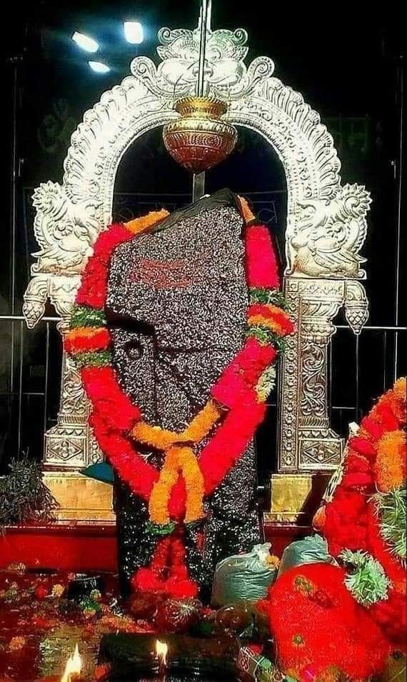 Temple deity decorated with flowers